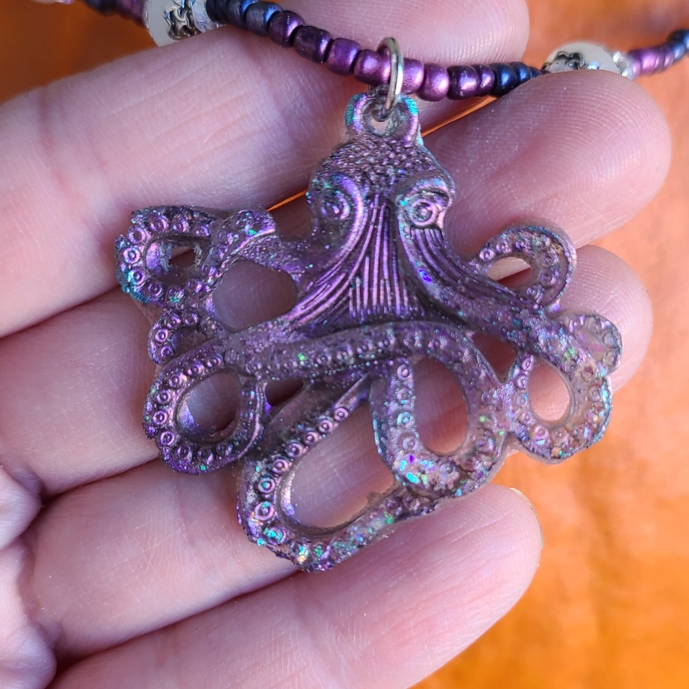 Handmade holographic octopus pendant with glass and moon stone beads. Adjustable